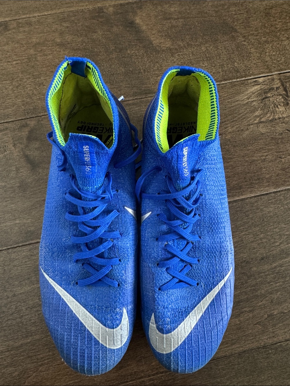 Nike Blue Soccer Cleats with Silver Swoosh and Neon Green Lining